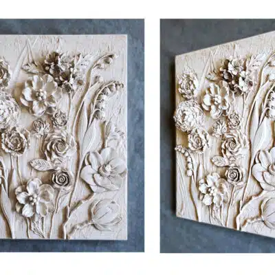 3D floral plaster relief wall art panel with sculpted roses and botanical flowers shown in front and angled view